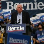 Topless dairy industry protesters crashed the stage at a Bernie Sanders rally