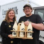 Fresh milk in glass bottles vends itself