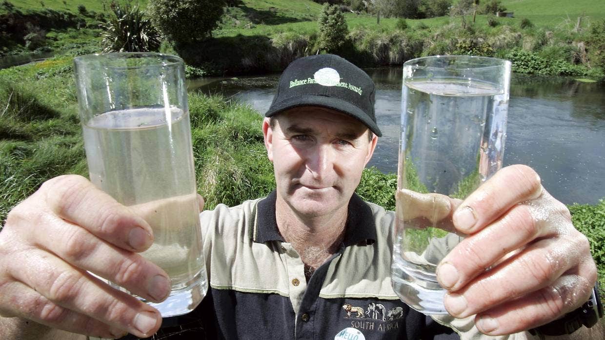 Talking about water quality used to be “especially hard work”, said Martin Bennett. He’s pictured in 2006 with samples of water from his spring behind him, right, and from some 10 metres downstream