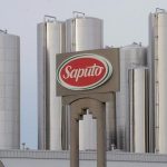 Canadian dairy processor Saputo Inc. more than doubled its profit in its latest quarter amid higher prices, improved productivity and strong sales, company executives said Friday. A sign at a Montreal Saputo plant is shown on Jan.13, 2014.