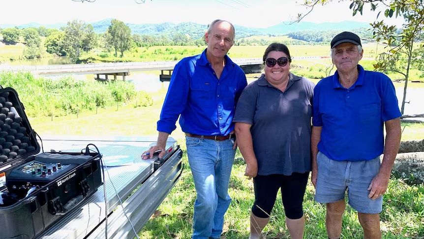 Neil Baker, Darryl Kennedy and Amy Kennedy on Neil's farm on the Tweed.