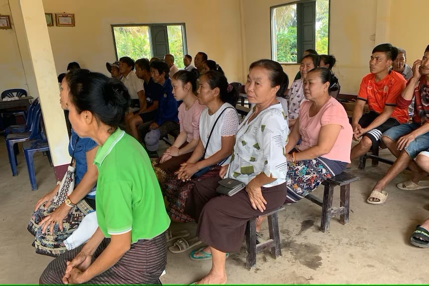 AgCo staff explain to the local villagers how the blocks reduced methane and why they can get them for free.