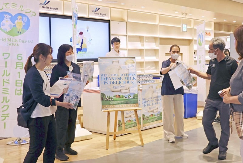 Struggling Japanese dairy producers serve milk to inbound visitors, eye exports