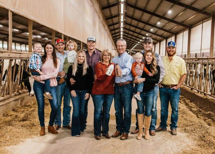 The Volleman family smiles for a photo at their dairy farm in Gustine. The family business now offers its glass-bottled milk in several businesses across East Texas.