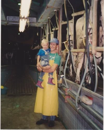 Frank Volleman, owner of Volleman Family Farm, smiles for a photo with son David Volleman. The family recently started selling their milk in glass bottles across East Texas.Courtesy